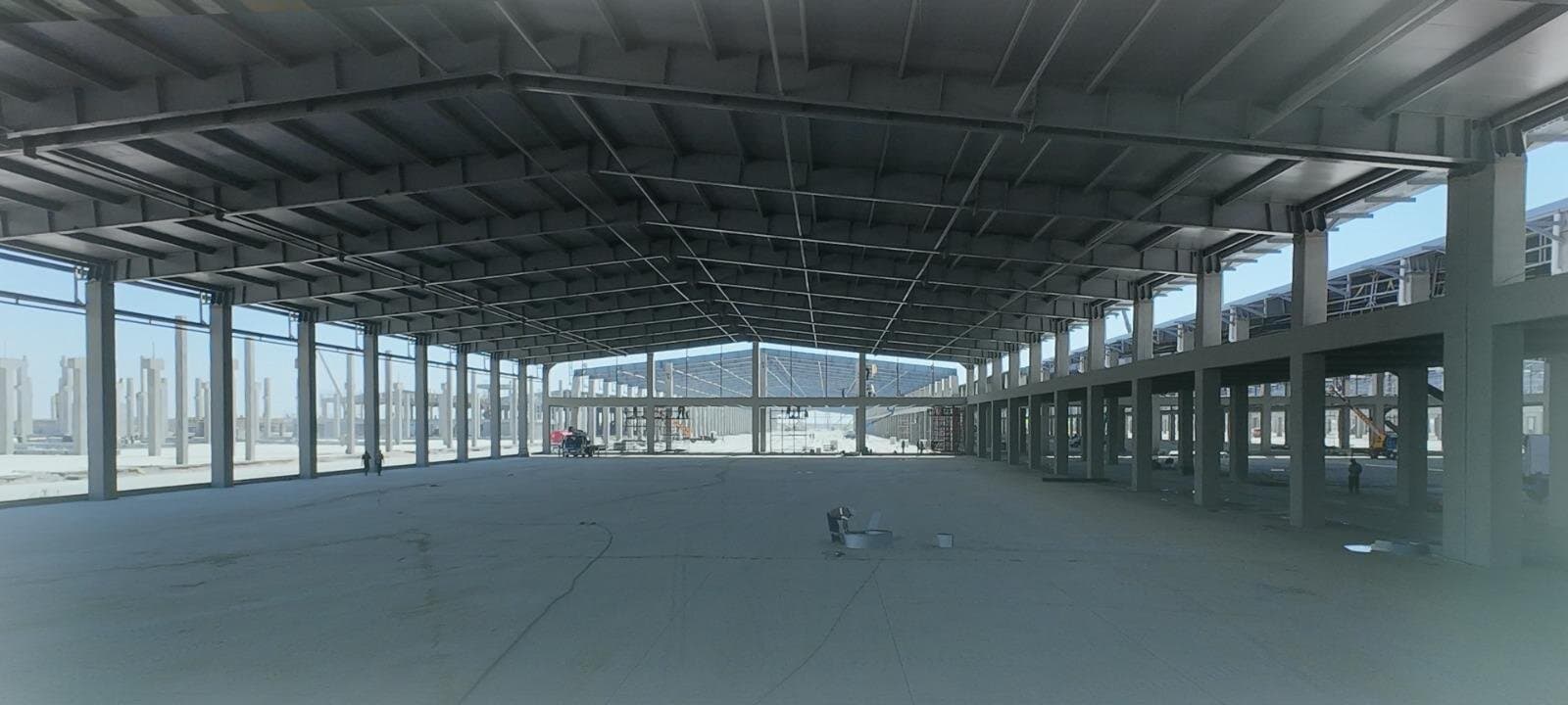 The open floor of a production hall at Diwan's plant, columns running to the far wall